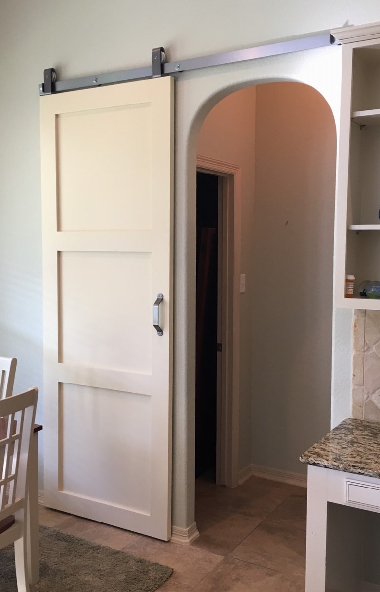 Quaker style barn door in Honolulu kitchen.